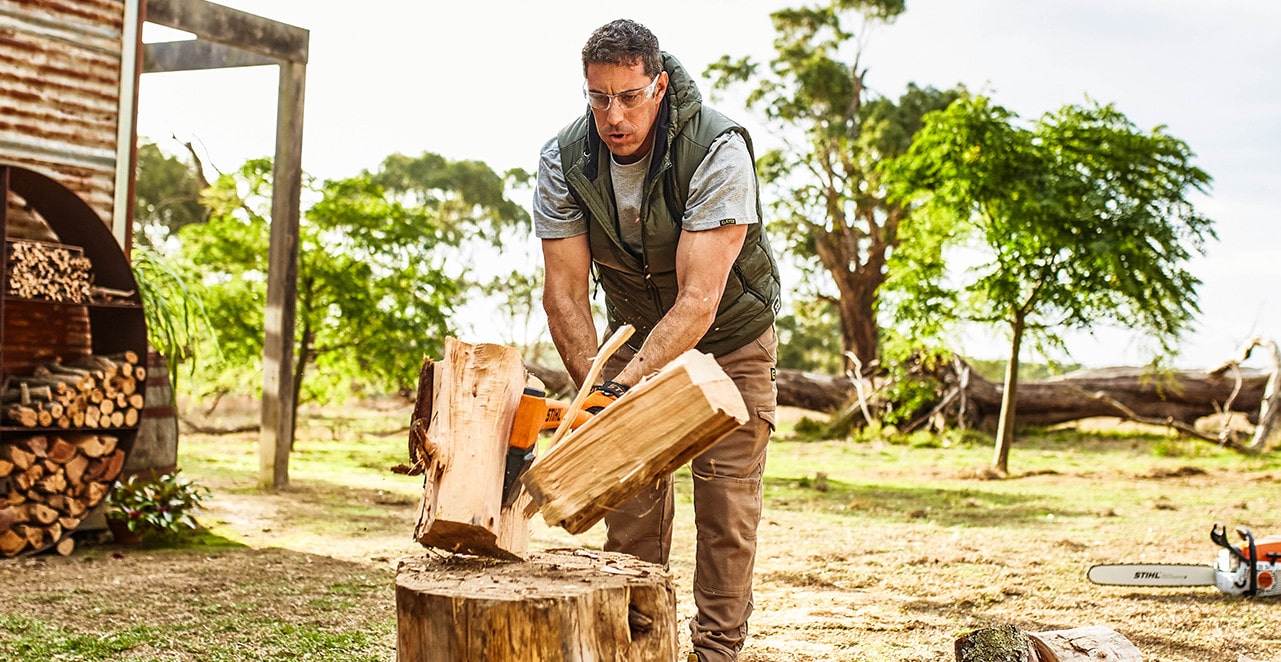 Man cutting wood with axe